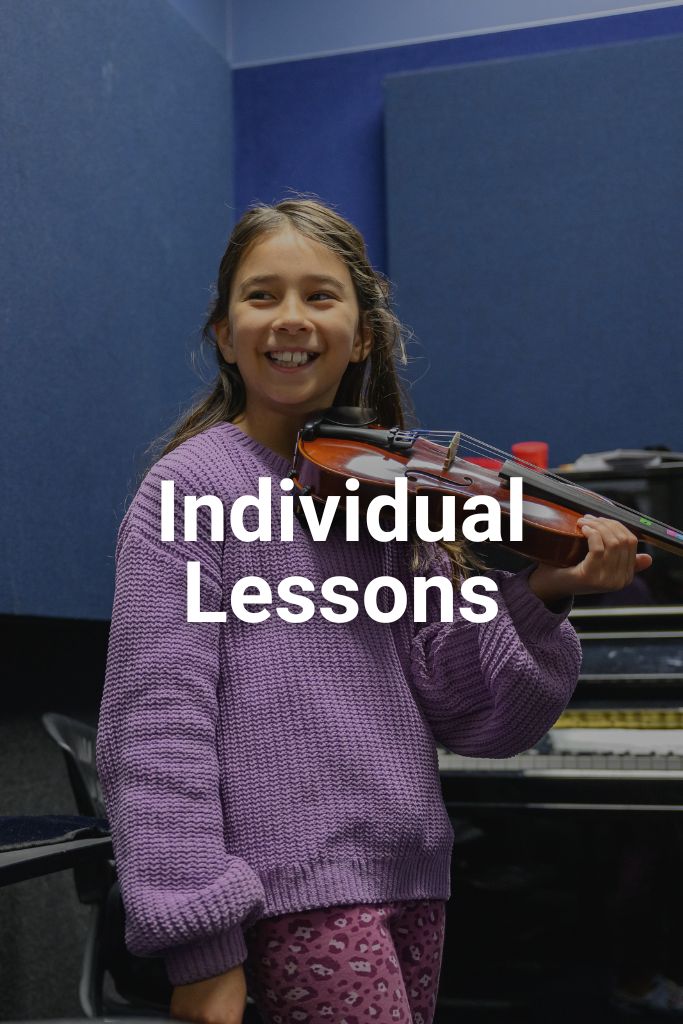 Girl playing the violin and smiling. Caption is Individual Lessons. Click on this image to view the individual lessons page.