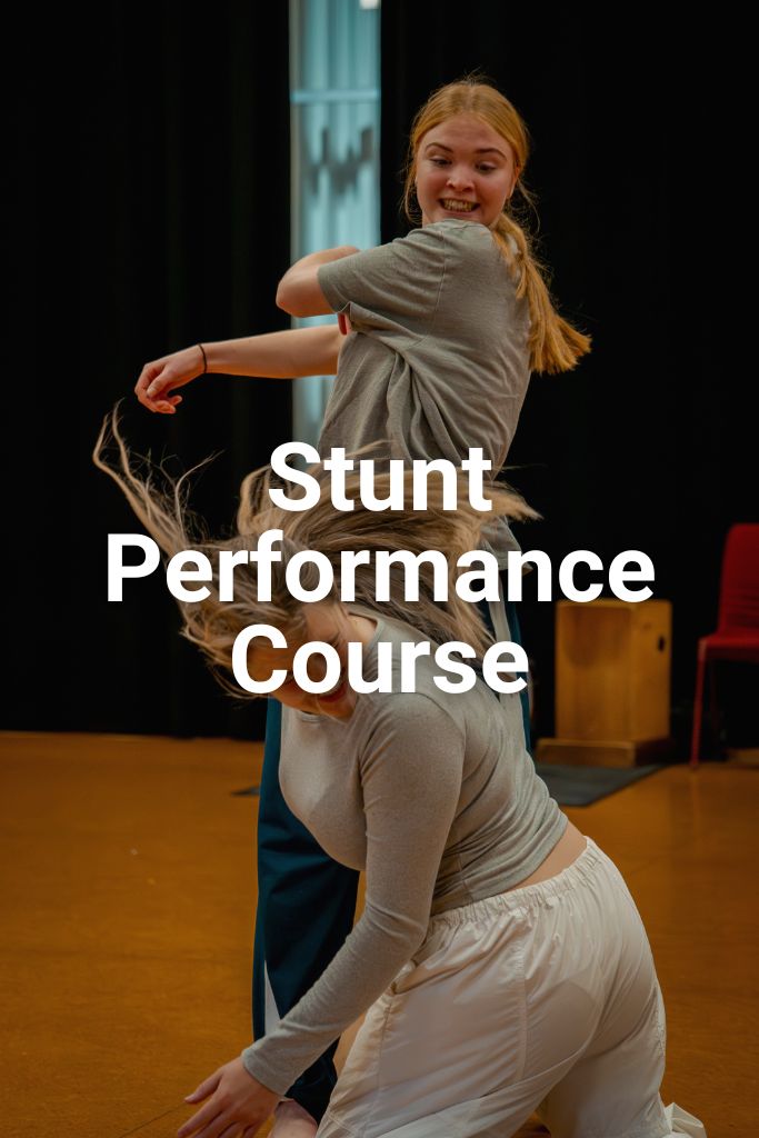 One girl stands over another girl after just pretending to slap her face. Click here to learn more about the Stunt Performance Course.